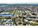Aerial view showcasing property surrounded by lush landscapes near tranquil water bodies at 9222 134Th St, Seminole, FL 33776