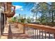Balcony showcasing its expansive wooden deck with railing and scenic view beyond at 9222 134Th St, Seminole, FL 33776