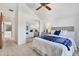 Bedroom featuring a ceiling fan, mirrored closet doors, and an open doorway to another room at 9222 134Th St, Seminole, FL 33776