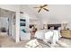 Spacious primary bedroom featuring neutral tones, vaulted ceilings, and an attractive ceiling fan at 9222 134Th St, Seminole, FL 33776