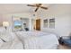 Bedroom featuring a plush bed, mirrored closet doors, and an open doorway to another room at 9222 134Th St, Seminole, FL 33776