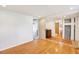 Versatile bonus room with hardwood floors, an open layout, and multiple doorways for seamless connectivity at 9222 134Th St, Seminole, FL 33776