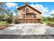 Attractive home featuring a multi-level deck, covered parking, and a welcoming entrance area at 9222 134Th St, Seminole, FL 33776