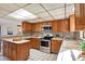 Bright kitchen featuring stainless steel appliances, generous counter space, and ample storage at 9222 134Th St, Seminole, FL 33776
