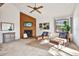 Cozy living area with wood-burning fireplace, unique wall art, and comfortable seating. The room is well lit and inviting at 9222 134Th St, Seminole, FL 33776