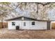 Exterior view of the home's backyard, showcasing a simple design at 9607 N 13Th St, Tampa, FL 33612