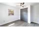 This bedroom features a ceiling fan, closet and luxury vinyl plank flooring at 9607 N 13Th St, Tampa, FL 33612