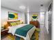 Charming bedroom with modern decor, colorful artwork, and ample space for rest and relaxation at 9607 N 13Th St, Tampa, FL 33612