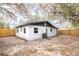 This exterior features a fenced yard and neutral paint at 9607 N 13Th St, Tampa, FL 33612