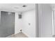 Functional utility room, featuring gray door, water heater, and laundry hookups at 9607 N 13Th St, Tampa, FL 33612