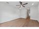 Bedroom featuring light wood flooring, modern ceiling fan, and access to en-suite at 1015 1/2 W Charter St, Tampa, FL 33602