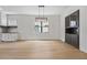 Dining area with wood floors and built-in shelving at 1015 1/2 W Charter St, Tampa, FL 33602