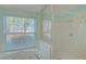 The bathroom features a combination tub and shower with a window at 10302 Belltower St, Spring Hill, FL 34608