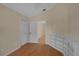This bedroom features a neutral color palette and hardwood floors at 10302 Belltower St, Spring Hill, FL 34608