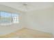 This bedroom features a large window with plenty of natural light at 10302 Belltower St, Spring Hill, FL 34608