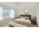 Comfortable bedroom with a cozy bed, neutral tones, natural light, and calming decor at 10302 Belltower St, Spring Hill, FL 34608