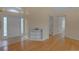 Inviting entryway featuring a tiled floor, half-wall shelving, and a modern front door at 10302 Belltower St, Spring Hill, FL 34608