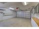 Spacious two-car garage featuring abundant storage, bright lighting, and an insulated garage door, offering organization and functionality at 10302 Belltower St, Spring Hill, FL 34608