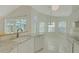 Spacious kitchen featuring a center island, a breakfast bar, and natural light at 10302 Belltower St, Spring Hill, FL 34608