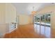 Living room featuring a sliding door, a view of the pool, and built in shelving at 10302 Belltower St, Spring Hill, FL 34608