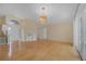 Bright living room with beautiful flooring, stylish lighting and clear entry view at 10302 Belltower St, Spring Hill, FL 34608