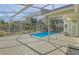 This screened-in pool offers shade and privacy for the homeowner at 10302 Belltower St, Spring Hill, FL 34608