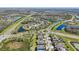Community aerial view showcases the surrounding landscaping, roads, and neighborhood layout at 10642 Mistflower Ln, Tampa, FL 33647