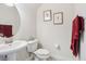 Half bathroom featuring a pedestal sink and decorative accents at 10642 Mistflower Ln, Tampa, FL 33647