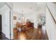 Dining room featuring hardwood floors, classic decor, and an archway leading to other rooms at 10642 Mistflower Ln, Tampa, FL 33647