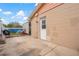 A concrete patio and backyard with blue skies provides a perfect outdoor entertaining space at 10724 Tabor Dr, Tampa, FL 33625