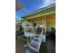 Cozy front porch with seating and decorative railings for a welcoming entrance at 10919 N Arden Ave, Tampa, FL 33612