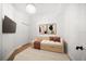 Spare bedroom with a comfortable daybed, soft lighting, and minimalist decor at 11 San Marco St # 307, Clearwater Beach, FL 33767