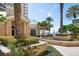 Exterior of building with lush tropical landscaping near the beach at 11 San Marco St # 307, Clearwater Beach, FL 33767