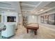 Elegant game room featuring a pool table, a fish tank, and stylish decor at 11 San Marco St # 307, Clearwater Beach, FL 33767
