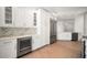 Bright kitchen featuring stainless steel appliances, a wine cooler, ample counter space, and plenty of storage at 11 San Marco St # 307, Clearwater Beach, FL 33767