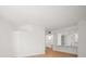 A spacious living area with pristine white walls and modern light hardwood flooring at 11 San Marco St # 307, Clearwater Beach, FL 33767