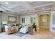 Elegant living room featuring coffered ceilings, neutral decor, and stylish furnishings at 11 San Marco St # 307, Clearwater Beach, FL 33767