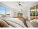 Bright main bedroom with a dresser, chairs, and large windows offering scenic views at 11 San Marco St # 307, Clearwater Beach, FL 33767