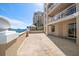 Wide-angle shot of a residential terrace, showcasing its size and architectural details at 11 San Marco St # 307, Clearwater Beach, FL 33767