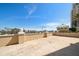 Expansive terrace with neutral pavers and a low perimeter wall for privacy at 11 San Marco St # 307, Clearwater Beach, FL 33767