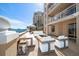 Elegant terrace offers outdoor seating and a cozy fire pit, perfect for relaxation at 11 San Marco St # 307, Clearwater Beach, FL 33767