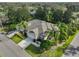 Aerial shot of the home featuring a well-maintained yard and landscaping at 1171 Corinth Greens Dr, Sun City Center, FL 33573