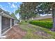 Landscaped backyard showcasing hedges and mature trees at 1171 Corinth Greens Dr, Sun City Center, FL 33573
