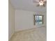 Bedroom with a window and fan on ceiling at 1171 Corinth Greens Dr, Sun City Center, FL 33573