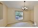 Bright bedroom featuring a large window and neutral tones at 1171 Corinth Greens Dr, Sun City Center, FL 33573