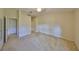 Beige bedroom with doorway and closet at 1171 Corinth Greens Dr, Sun City Center, FL 33573