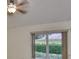Bedroom with a window and fan on ceiling at 1171 Corinth Greens Dr, Sun City Center, FL 33573