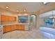 Bright kitchen featuring wood cabinets, white appliances, and an open layout at 1171 Corinth Greens Dr, Sun City Center, FL 33573