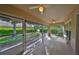 Relaxing screened lanai with ceiling fans, perfect for outdoor enjoyment at 1171 Corinth Greens Dr, Sun City Center, FL 33573