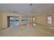 Spacious living room with neutral walls, carpet flooring, and natural light at 1171 Corinth Greens Dr, Sun City Center, FL 33573